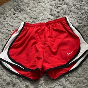Red Nike shorts